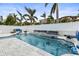 Stunning pool and patio with multiple seating areas and water features at 17706 1St E St, Redington Shores, FL 33708