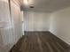 Spacious bedroom with wood-look vinyl flooring at 1833 Knollwood Dr, Holiday, FL 34690