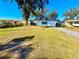 House with a spacious yard, offering ample outdoor space at 1833 Knollwood Dr, Holiday, FL 34690