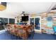 Outdoor bar with seating, flat screen tv and a tropical vibe at 2109 Elmwood Ct, Plant City, FL 33563