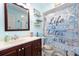 Charming bathroom with beachy decor and updated vanity at 2109 Elmwood Ct, Plant City, FL 33563