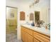 Clean bathroom with a double vanity and updated fixtures at 2109 Elmwood Ct, Plant City, FL 33563