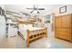 Bright bedroom with a wooden bed frame and an accent wall at 2109 Elmwood Ct, Plant City, FL 33563