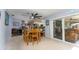 Open dining area with wood table and view into kitchen at 2109 Elmwood Ct, Plant City, FL 33563