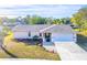 Single story home with attached garage and landscaped yard at 2109 Elmwood Ct, Plant City, FL 33563