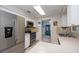 Modern kitchen with stainless steel appliances and white cabinets at 2109 Elmwood Ct, Plant City, FL 33563