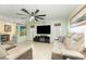Bright living room with ample seating and a large TV at 2109 Elmwood Ct, Plant City, FL 33563