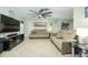 Spacious living room featuring comfortable seating and a large TV at 2109 Elmwood Ct, Plant City, FL 33563