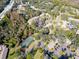 Aerial view of community near roadway, showing tennis court and buildings at 2912 Star Apple Ct, Palm Harbor, FL 34684