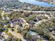 Aerial view showcasing community near water with tennis court at 2912 Star Apple Ct, Palm Harbor, FL 34684
