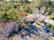 Aerial view of condo community showcasing building exteriors, parking, and landscaping at 2912 Star Apple Ct, Palm Harbor, FL 34684