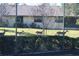 Home with fenced-in backyard, showing a herd of deer grazing along the green grass at 2912 Star Apple Ct, Palm Harbor, FL 34684