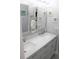 Bright bathroom with double vanity and walk-in shower at 2912 Star Apple Ct, Palm Harbor, FL 34684