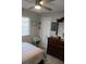 Cozy bedroom with a ceiling fan, neutral colors, and natural light at 2912 Star Apple Ct, Palm Harbor, FL 34684