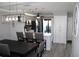 Open concept dining area with modern lighting and seating at 2912 Star Apple Ct, Palm Harbor, FL 34684