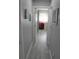 Gray hallway with light gray flooring and white doors at 2912 Star Apple Ct, Palm Harbor, FL 34684