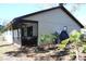 Rear view of house with screened porch at 2912 Star Apple Ct, Palm Harbor, FL 34684