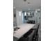 Modern kitchen with white cabinets and a large island at 2912 Star Apple Ct, Palm Harbor, FL 34684
