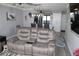 Comfortable living room with reclining sofa and coastal decor at 2912 Star Apple Ct, Palm Harbor, FL 34684