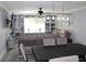 Spacious living room with built-in shelving and comfy seating at 2912 Star Apple Ct, Palm Harbor, FL 34684