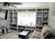 Relaxing living room with built-in shelving and window seat at 2912 Star Apple Ct, Palm Harbor, FL 34684