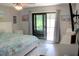 Main bedroom features a king bed and access to private balcony at 2912 Star Apple Ct, Palm Harbor, FL 34684
