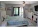 Spacious main bedroom with sliding glass doors to balcony at 2912 Star Apple Ct, Palm Harbor, FL 34684