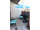 Small patio with umbrella and seating at 2912 Star Apple Ct, Palm Harbor, FL 34684