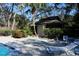 Community pool with shower and lounge chairs at 2912 Star Apple Ct, Palm Harbor, FL 34684