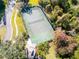 Community tennis court with wooden gazebo, surrounded by trees and landscaping at 2912 Star Apple Ct, Palm Harbor, FL 34684