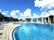 Inviting pool with a fountain and plenty of lounge chairs at 29242 Caddyshack Ln, San Antonio, FL 33576