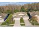 Two story home with a two-car garage and a large yard at 2932 Tanglewylde Dr, Land O Lakes, FL 34638