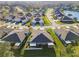 Aerial view of houses in a residential community at 2932 Tanglewylde Dr, Land O Lakes, FL 34638