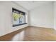 Large bedroom with hardwood floors and a window seat at 2932 Tanglewylde Dr, Land O Lakes, FL 34638