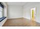 Bright bedroom with hardwood floors and en-suite bathroom access at 2932 Tanglewylde Dr, Land O Lakes, FL 34638
