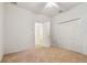Bright bedroom with double door closet and neutral carpeting at 2932 Tanglewylde Dr, Land O Lakes, FL 34638