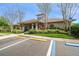 Community clubhouse with parking and landscaping at 2932 Tanglewylde Dr, Land O Lakes, FL 34638