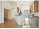 Kitchen features a breakfast bar, wood cabinets, and stainless steel appliances at 2932 Tanglewylde Dr, Land O Lakes, FL 34638