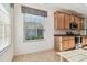 Kitchen with wood cabinets, granite counters, and stainless steel appliances at 2932 Tanglewylde Dr, Land O Lakes, FL 34638