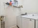 Laundry room with washer, dryer, and shelving at 2932 Tanglewylde Dr, Land O Lakes, FL 34638