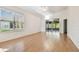 Spacious living room with sliding doors to screened patio at 2932 Tanglewylde Dr, Land O Lakes, FL 34638