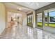 Spacious sunroom with sliding doors leading to the kitchen and backyard at 2932 Tanglewylde Dr, Land O Lakes, FL 34638