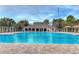 Large community pool with a pool house and flagpole at 30826 Prout Ct, Wesley Chapel, FL 33543