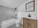 Modern bathroom with gray marble tile and wood vanity at 3105 N 17Th St, Tampa, FL 33605