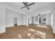 Open living area with hardwood floors and ceiling fans at 3105 N 17Th St, Tampa, FL 33605