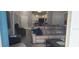 Spacious living room with sectional sofa, large TV, and view to the kitchen at 3611 19Th N St, St Petersburg, FL 33713