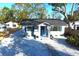 Newly renovated home with blue door and gravel landscaping at 419 40Th S Ave, St Petersburg, FL 33705