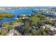 Aerial view of waterfront property with lush landscaping and private dock at 419 40Th S Ave, St Petersburg, FL 33705