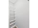 White closet with five shelves for storage at 4302 W Iowa Ave, Tampa, FL 33616