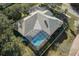 House with pool and landscaped yard, seen from above at 456 Diamond Dr, Spring Hill, FL 34609